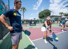 Art of Pickleball pros giving instructions for video lessons.